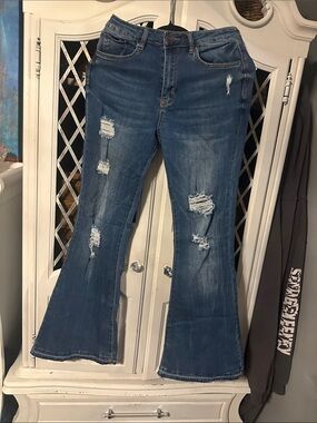 Distressed medium dark bell bottom jeans